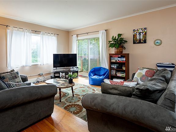 The living room is large with original fir floors and loads of natural light. 