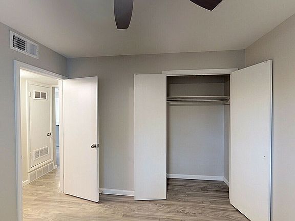 Step into modern elegance with this beautifully designed bedroom featuring ample storage.