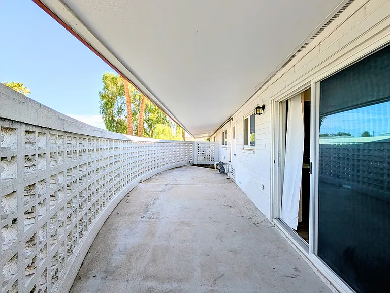 Large private patio, mainly concrete, and a small area to plant something, etc.