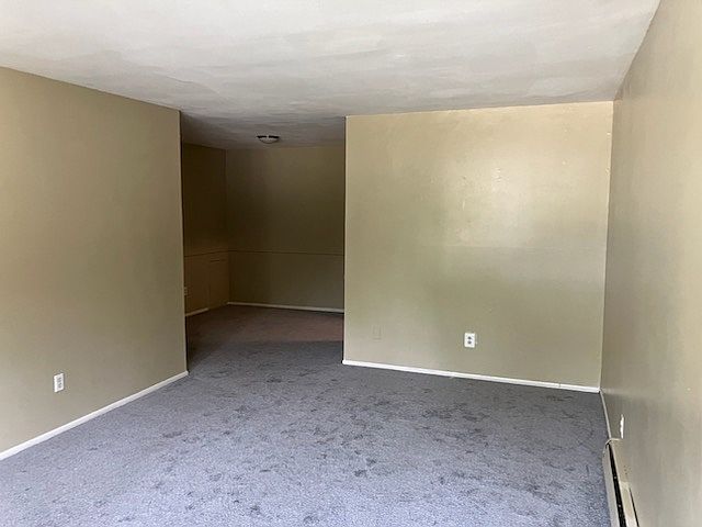 Living room leads to a dining area off the kitchen