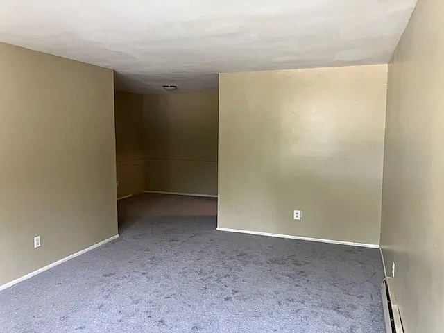Living room leads to a dining area off the kitchen