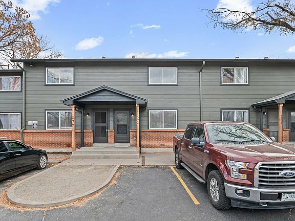 Experience the charm of this beautifully designed townhouse with a welcoming entrance and ample parking.