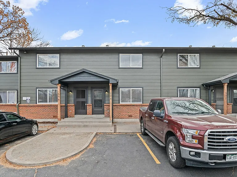 Experience the charm of this beautifully designed townhouse with a welcoming entrance and ample parking.