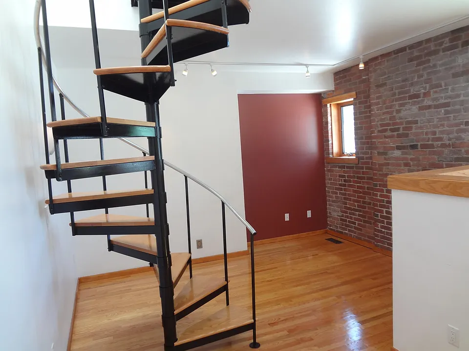 Living Room with spiral stairs