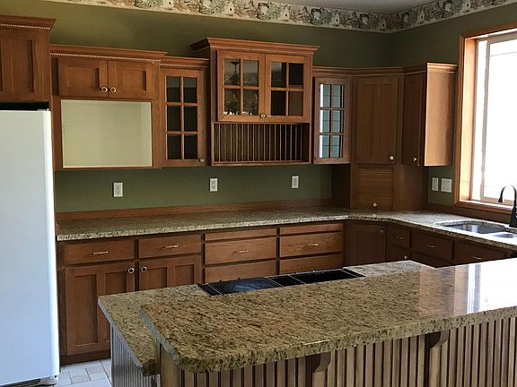 Custom kitchen with walk in pantry. Granite countertops , ti