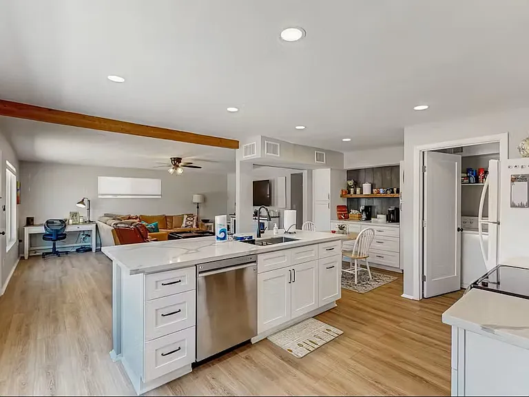 Kitchen, open room to living room area.