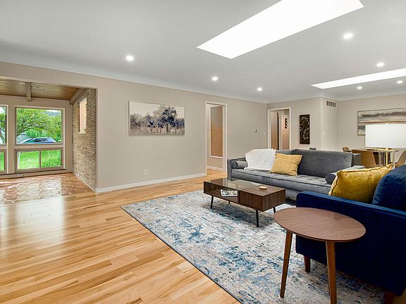 Livingroom with skylights, hardwood floors.