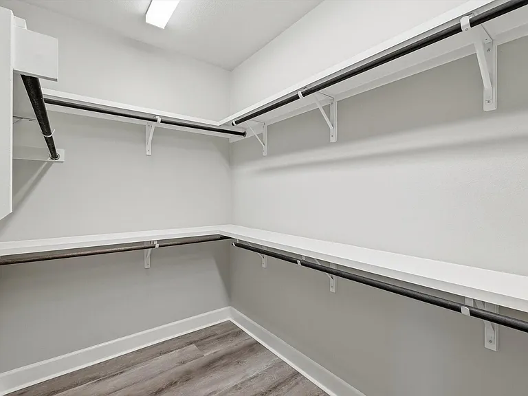 Large walk-in closet off primary bathroom.