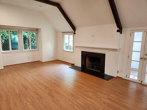 Livingroom with gas fireplace and wood beams