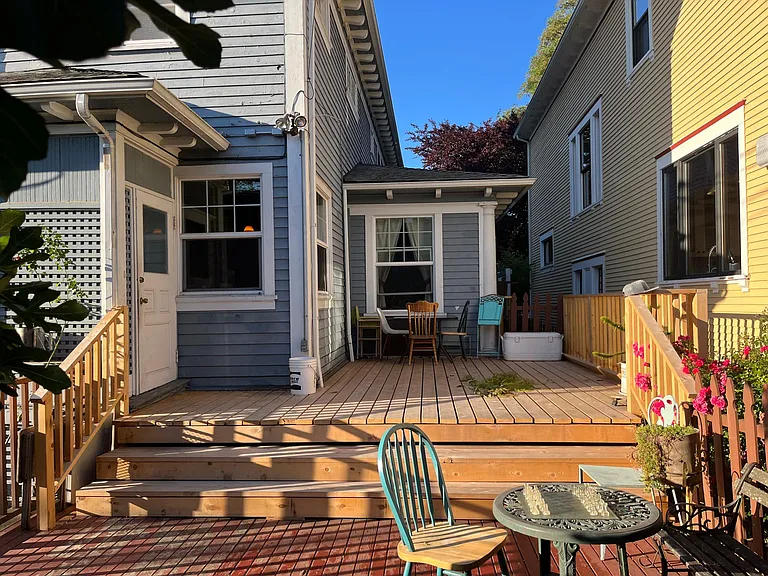 Backyard | Quiet two-level Alaska Yellow Cedar deck with afternoon sun.