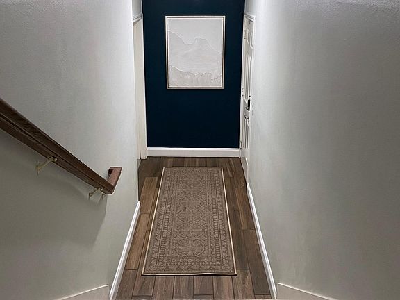 Entryway, with front door on the right and garage/laundry access on the left