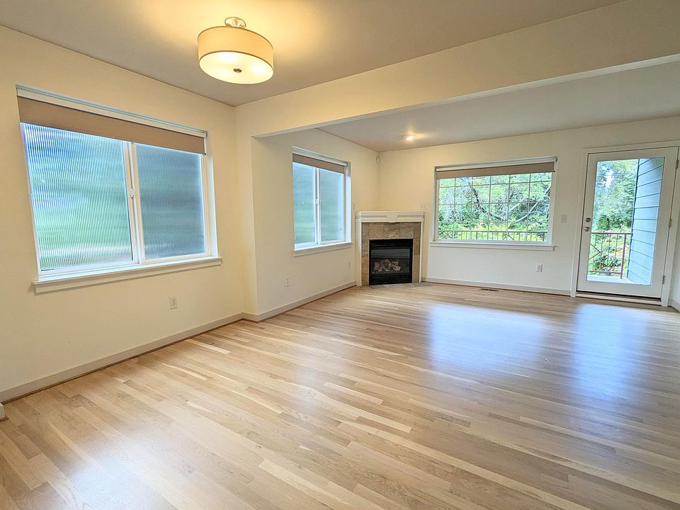 2nd floor - Living room with gas fireplace and west-facing deck
