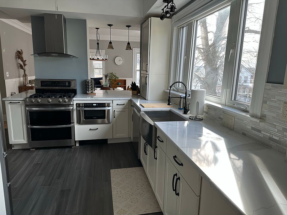 Kitchen with gas stove, dishwasher, full refrigerator