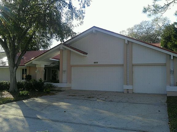 3 car garage with cupboards/storage