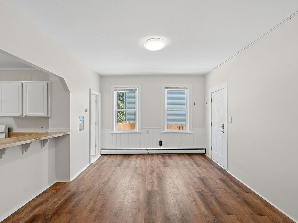 Living room with east sunlight angle 2. Open floor concept with the kitchen.