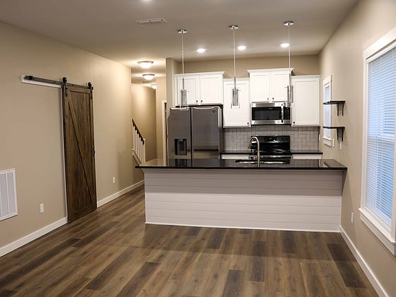 Open Floor Plan with Living Room, Breakfast Table Area & Kitchen with Bar