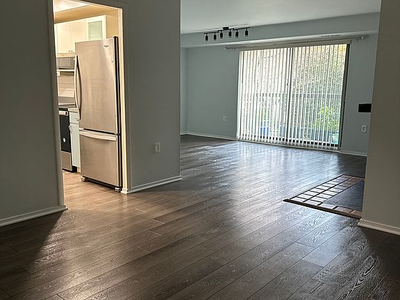 Dining room right outside of the kitchen which leads into the living room area.