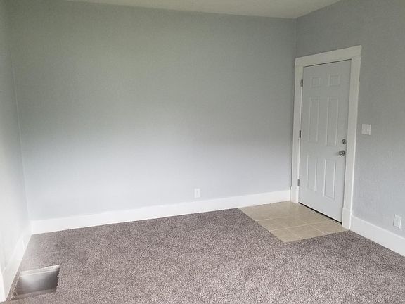 Living room looking southeast at the front door.