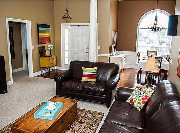 Family room has tall ceilings which add to the open feel of the home.