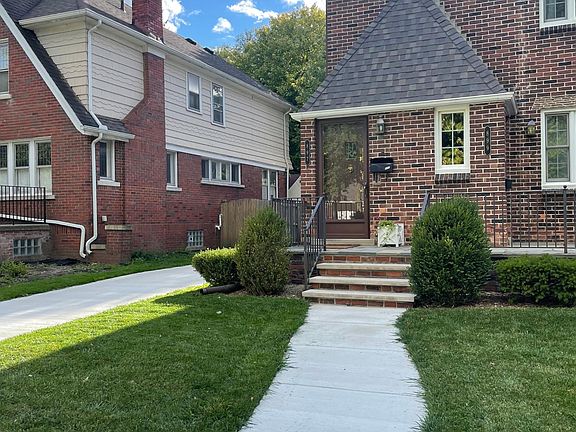 New walkway, porch steps, driveway and garage.