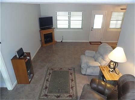 Family Room - Tile floors, Faux fireplace in corner, 2in blinds
