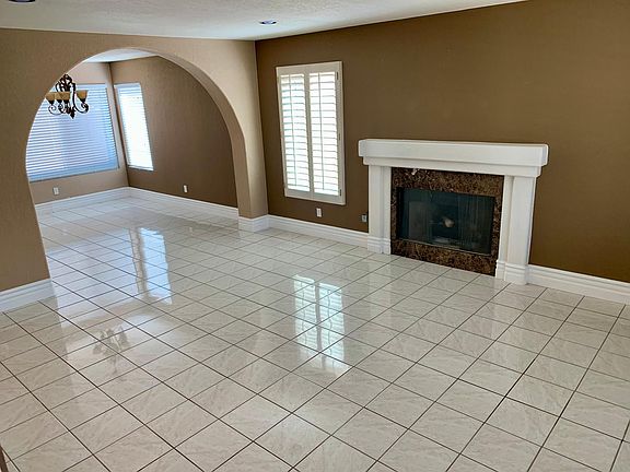 Family room in the foreground, dining room in the background.
