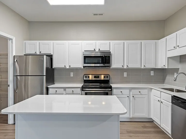 Select kitchens are complete with expansive kitchen islands and pantries.