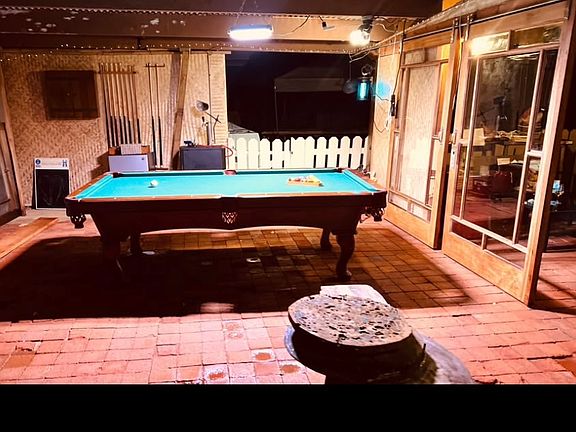Pool table in carport.