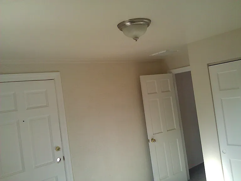 2nd bedroom with door to private yard