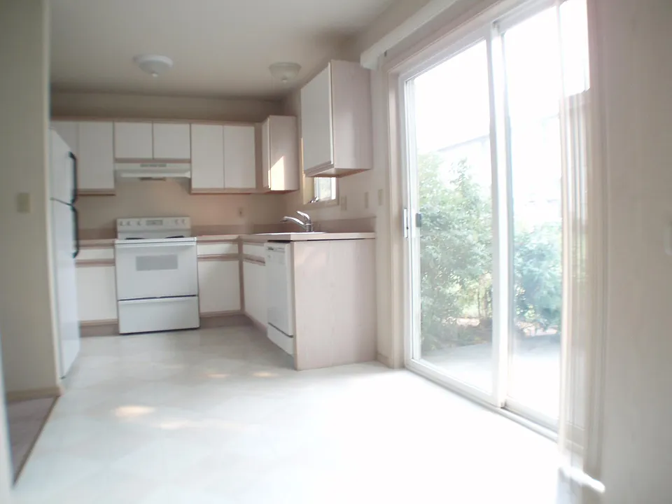 kitchen & dining area opening onto private patio.