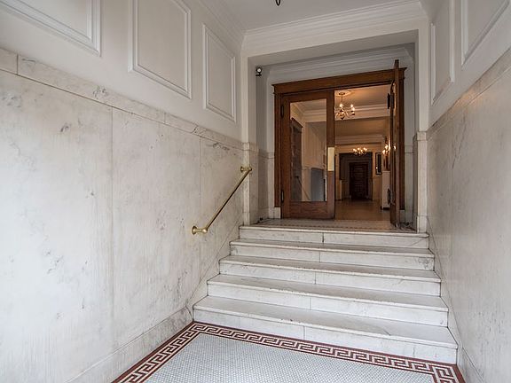Old-World charm in this foyer with marble finishes