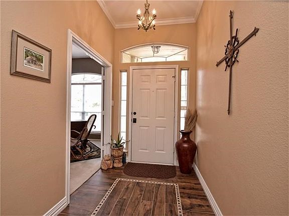 Lovely foyer, with wood look tile, in all common areas.