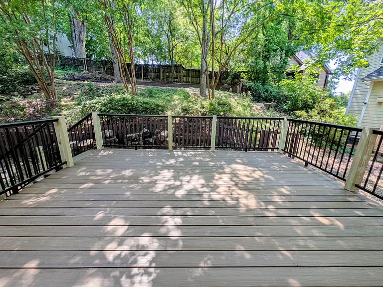 Newly remodeled back deck made with beautiful and easy to clean composite decking and powder coated aluminum railings. it has no exposed screws and perfectly smooth, so no possibility of splinters!
