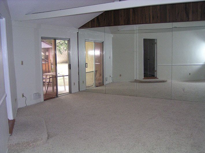 Downstairs Bedroom With Entrace To The Backyard