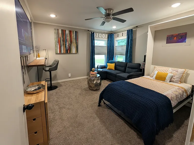 A relaxing, fun and adaptable space. The Murphy Bed is a Twin XL. The blinds are top -down/bottom-up. So you can control the amount of natural light while maintaining privacy.