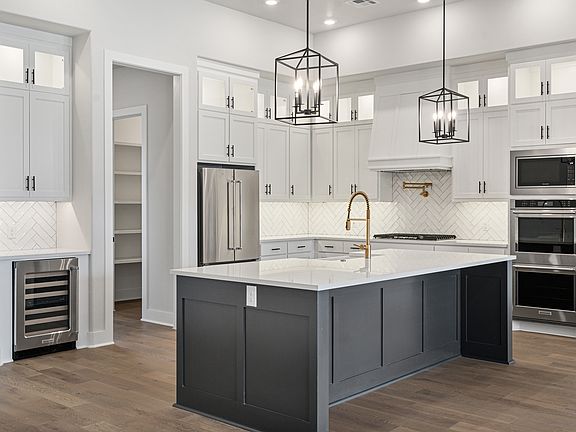 The upgraded kitchen has upgraded, stainless-steel appliances.