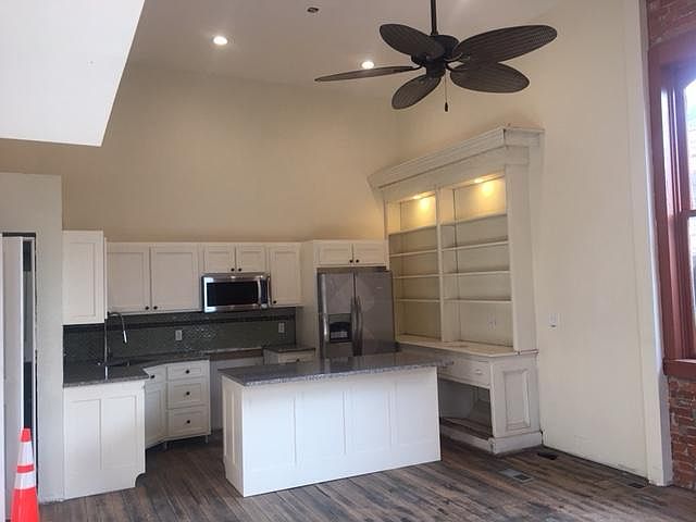 Kitchen is well equipped with lots of cabinets and storage space
