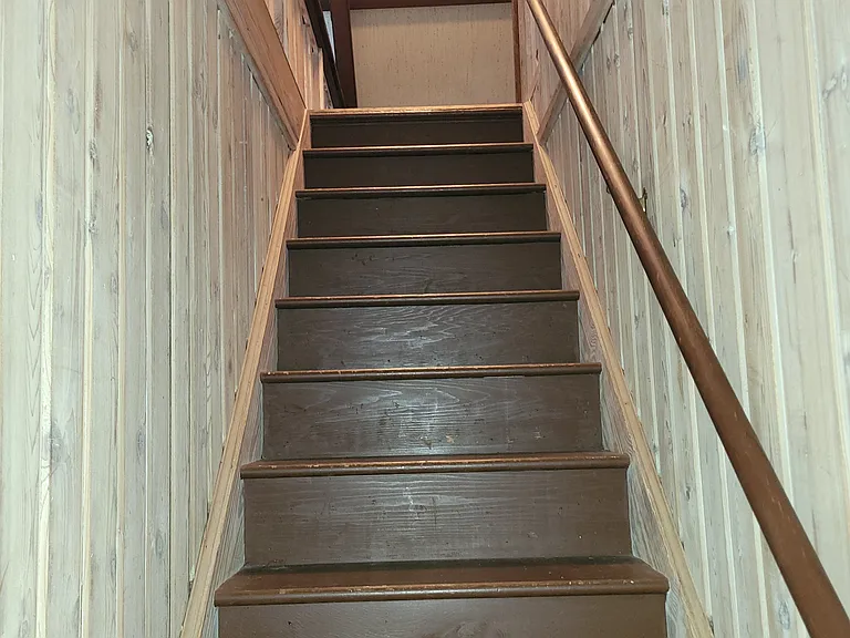 Stairs to the open loft bedroom