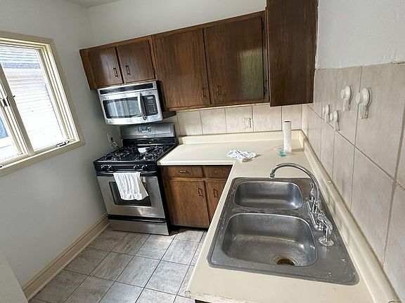 ample counter space, and tons of natural light, plus a bonus balcony exit.