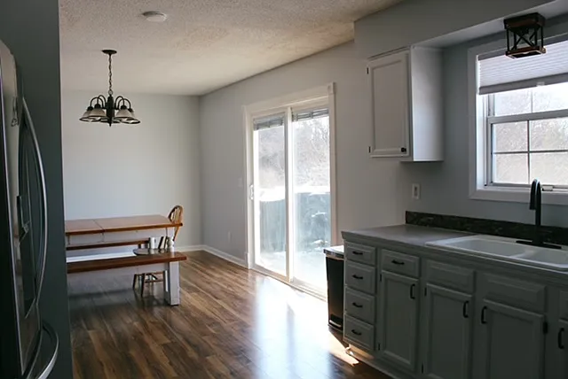kitchen, looking into the dining room. Sliding door to back deck.