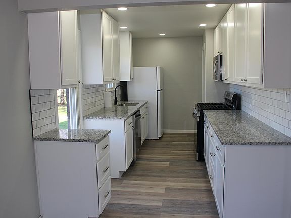 The kitchen is open to the dining room where we removed the original wall.