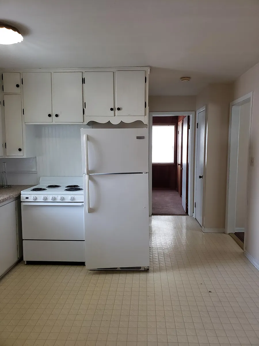 Standing in dining area looking at 2nd bdrm doorway. - 215 E North St #2