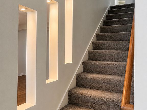 Staircase leading up to the four bedrooms, game room, laundry room and other restrooms.