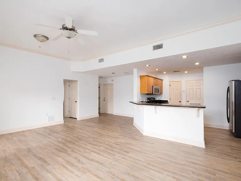 Large and open concept. High ceilings with crown moldings.