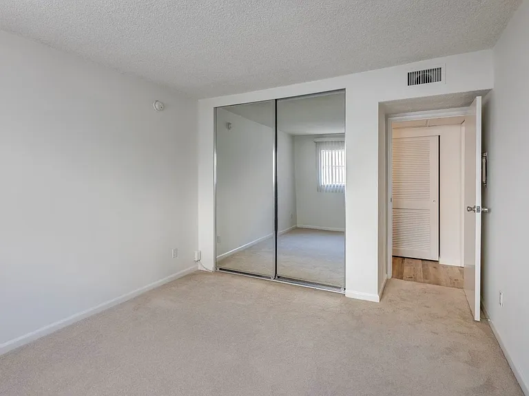 Apartments in West Los Angeles, CA Del Rio mirrored closet doors in bedroom