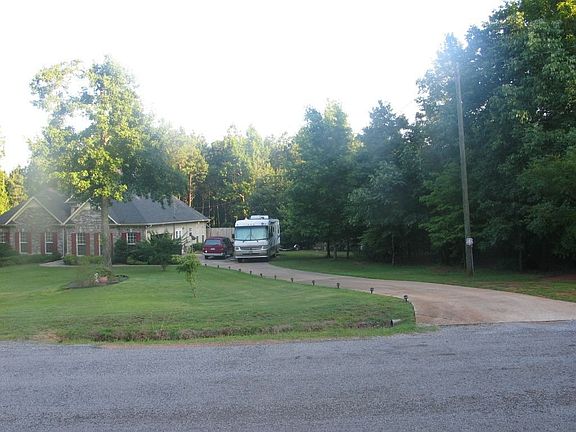 Well back from the road with room for RV