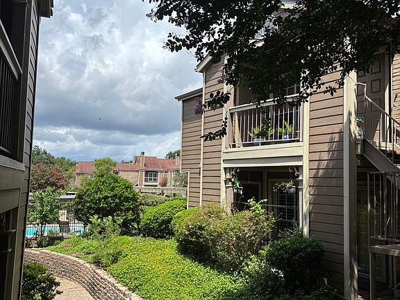 View of front of unit with pool in background