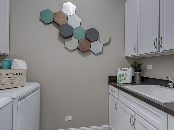 Laundry room with cabinet space