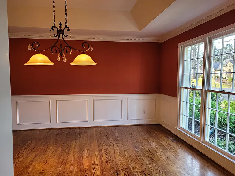 Dining Room with door-to-ceiling windows and tray ceiling