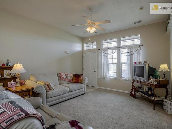 Front door with plenty of east-facing windows for plenty of sun in the living room.